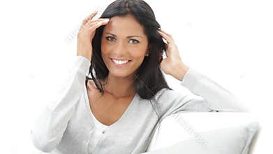 Smiling latin woman on couch