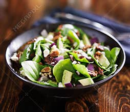 Bowl of fresh avocado spinach salad