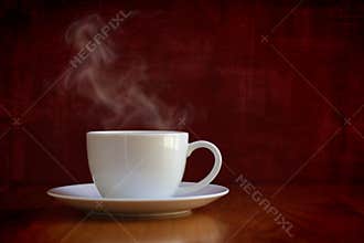Steaming white cup of coffee or tea
