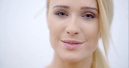 Smiling Face of Pretty Woman Looking at Camera