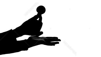 Magician shows the trick with two magic balls