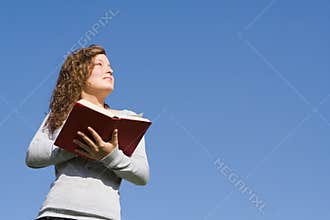 Child reading book or bible