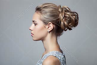 Beautiful Blond Woman. Hairstyle and Make-up.