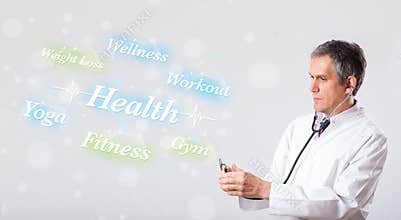 Clinical doctor pointing to health and fitness collection of words