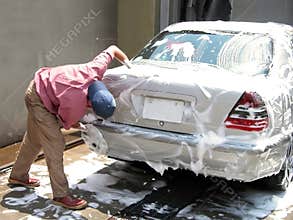 Man cleaning the car