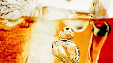 Close-up of whiskey in glass with ice used for background