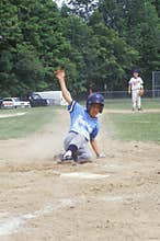 Baseball player sliding into base, Little League game, Hebron, CT