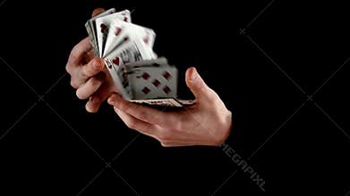 Magician shuffling the cards, on black, slow