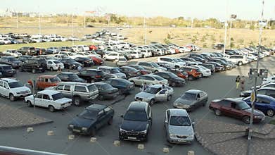 Lots of cars parking in the city