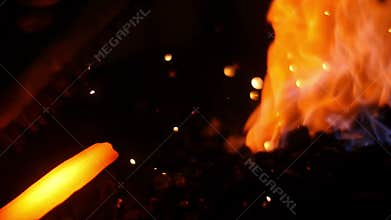 Forging a Swords with Fire Sparks