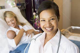 Doctor Standing In Her Patients Room