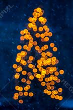 Evening christmas tree- snowflakes, lights bokeh