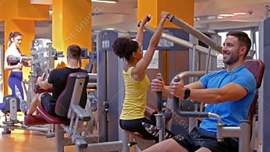Fit people working out in gym