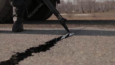 Sealing joint - crack in asphalt