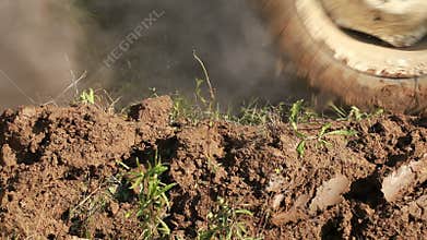 Plowing Soil with Tractor