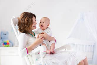 Mother and baby in white bedroom
