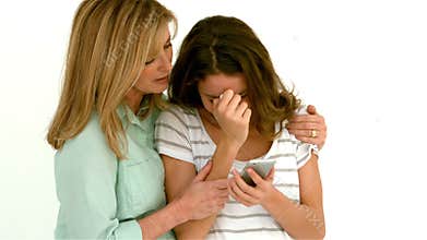 Mother comforting her daughter