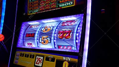 Close up woman playing slot machine