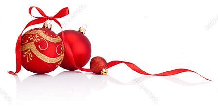 Red christmas decoration baubles with ribbon bow isolated