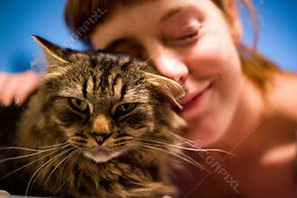 Woman loving her pet cat