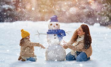 Mother and child girl on a winter walk in nature