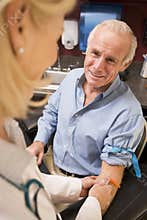Middle Aged Man Having Blood Test Done