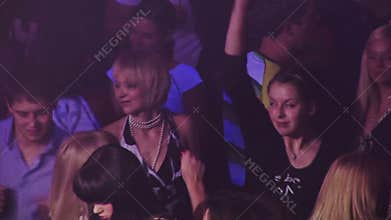 Boys and girls dancing at a party at the club