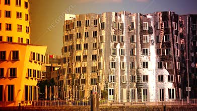 DUSSELDORF, GERMANY: Frank O. Gehry's distorted buildings and Rhinetower in the media harbor district in Dusseldorf. Ultra hd 4k,r