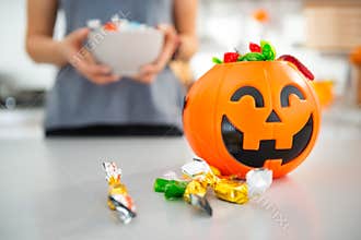 Closeup on halloween bucket full of trick or treat candy
