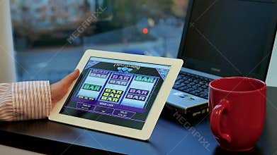 Close up woman playing slot machine game