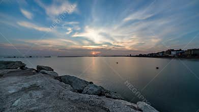 Sunrise from sea with dramatic intense sky. Amazing landscape