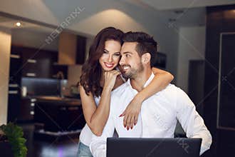 Happy young successful manager couple at home