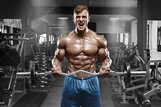 Muscular man working out in gym doing exercises with barbell at biceps, strong male naked torso abs