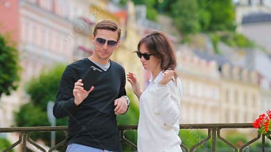 Selfie photo by caucasian couple traveling in Europe. Romantic travel woman and man in love smiling happy taking self