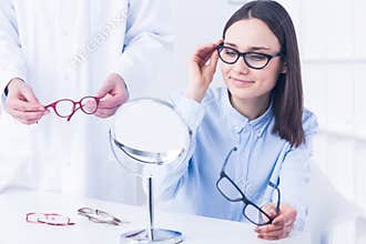 Woman with vision defect and optician's consultation