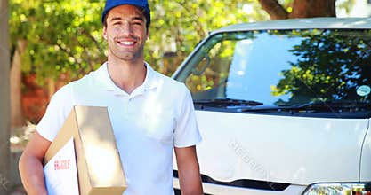 Delivery man carrying a parcel