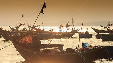 Closeup Fishing Boat Silhouettes in Sea Bay at Sunset in Vietnam