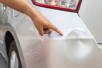 Backside of silver car get damaged by accident