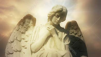 The statue of an Angel on time lapse golden clouds - Angel 0102 HD