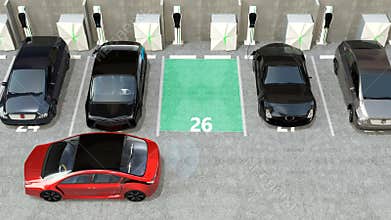 Red electric car driving into parking lot navigated with parking assist system