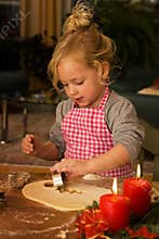 A child at Christmas in Advent when baking cookies