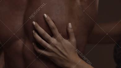Woman's hand and torso of man