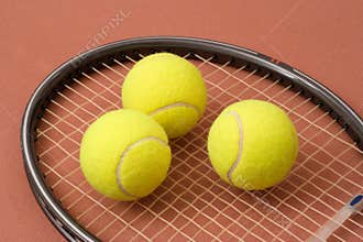 Tennis balls and racket