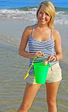 Pretty girl collecting shells