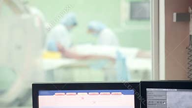 Unrecognizable Surgeons team performing operation in hospital operating room. Surgeon operating patient.