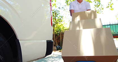 Delivery man carrying parcels