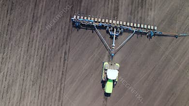 Tractor in the field sow sunflower