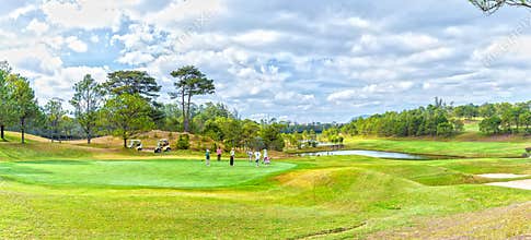 Family playing golf under the valley