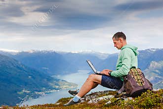 Man working outdoors with laptop
