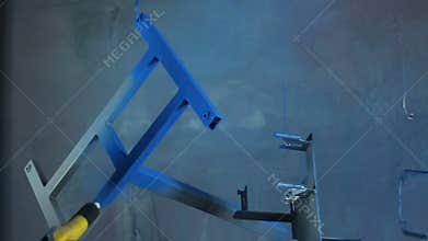 Powder coating of parts at the factory